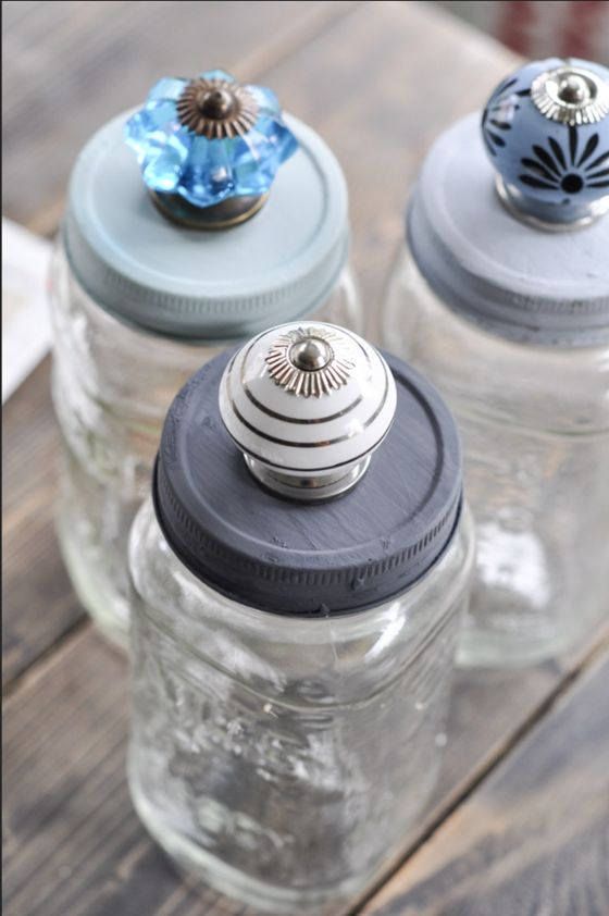 Mason jars with handles on the lids.